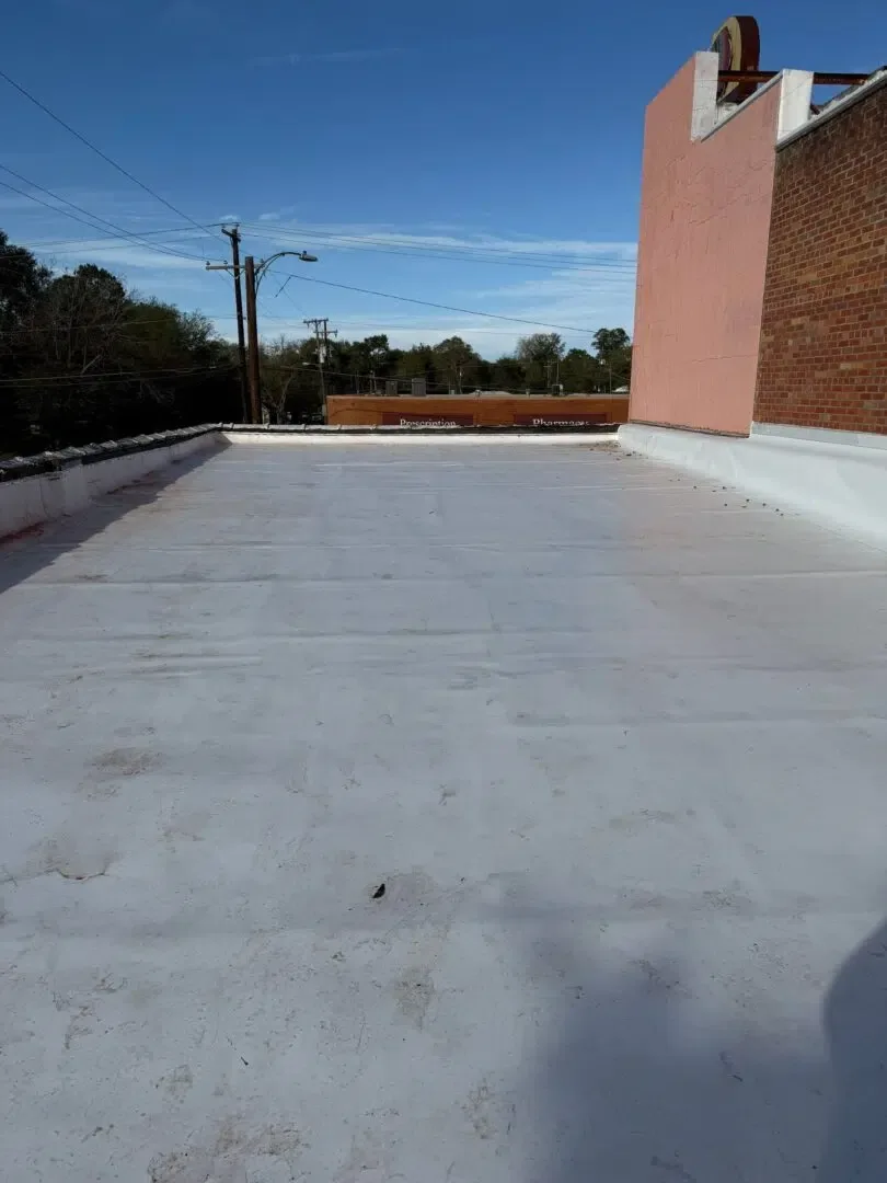 TPO membrane being laid on a commercial flat roof in Lufkin, Texas